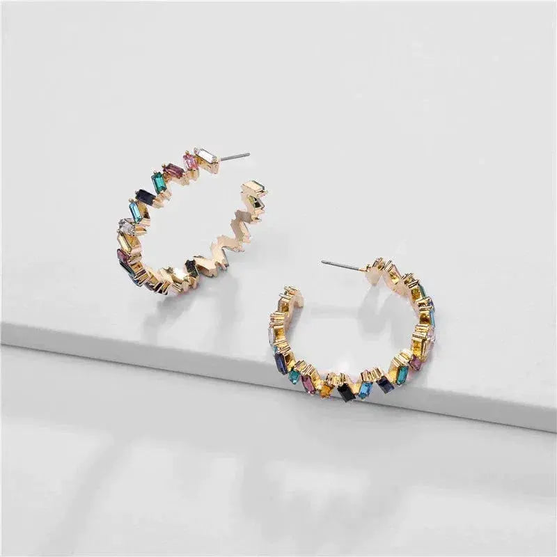 Gold earrings with colored stones