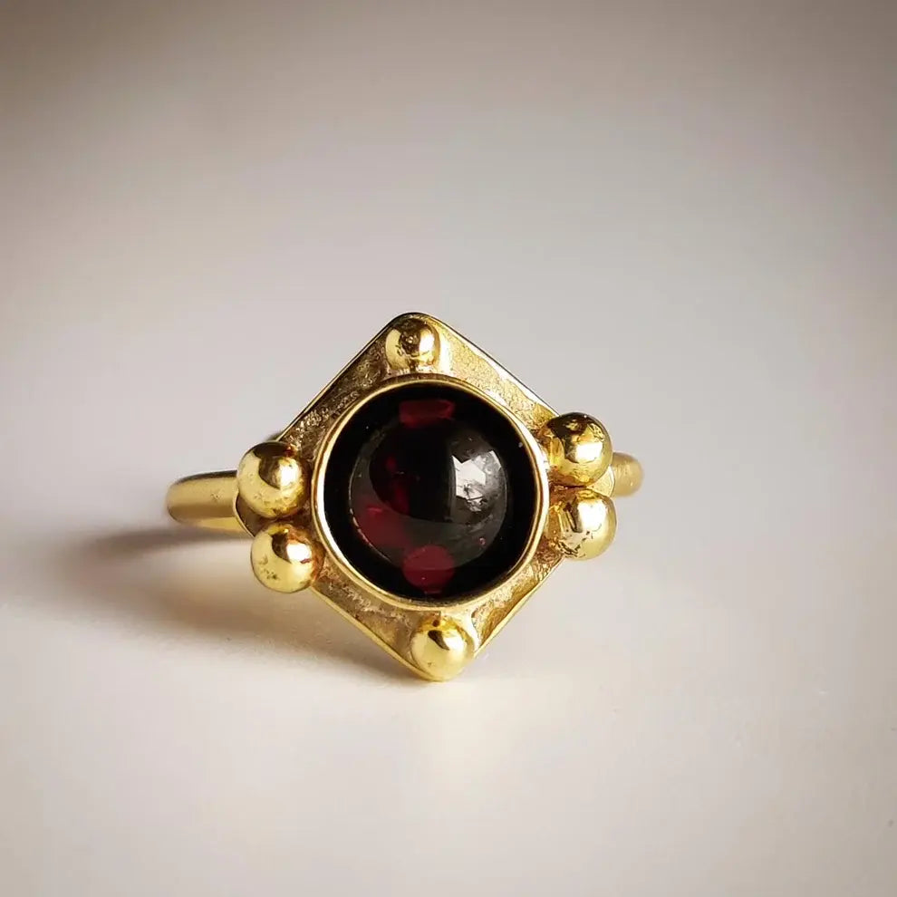Vintage ring made of red crystal in gold
