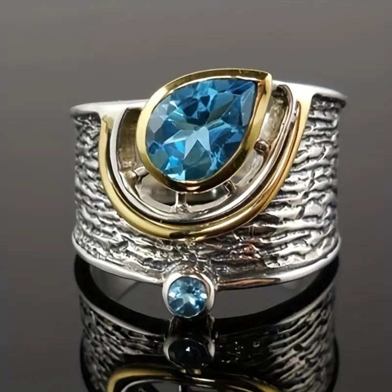 Ring made of silver & gold with blue crystals