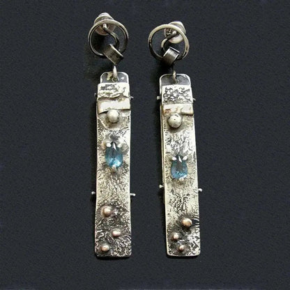 Handmade earrings made of blue stone