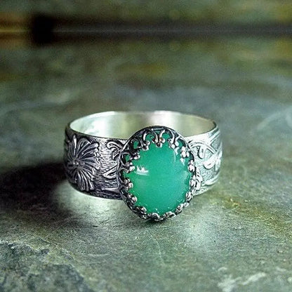Emerald ring with carved flower