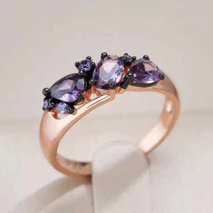 Elegant ring with purple crystals in gold