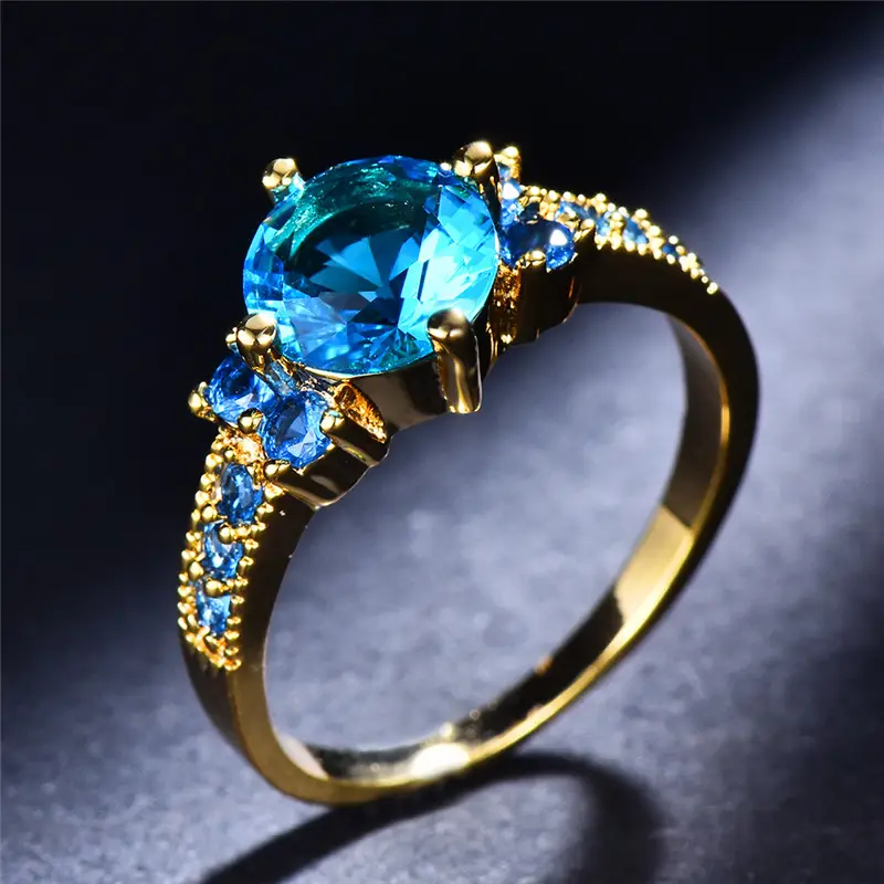Gold ring with sky blue zirconia