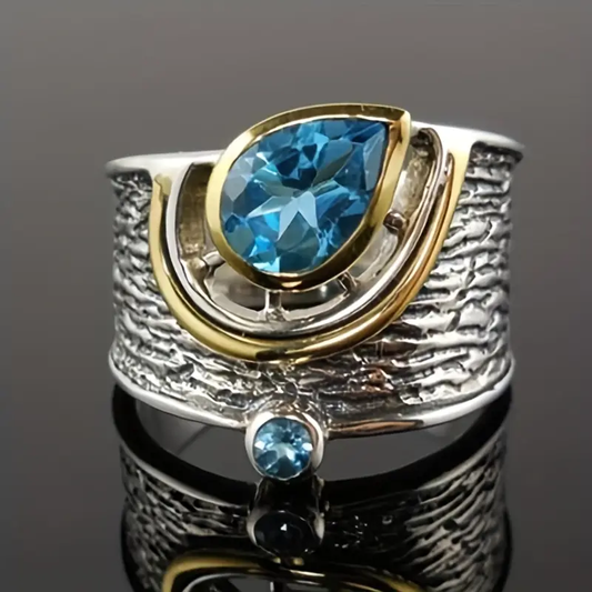 Ring made of silver & gold with blue crystals