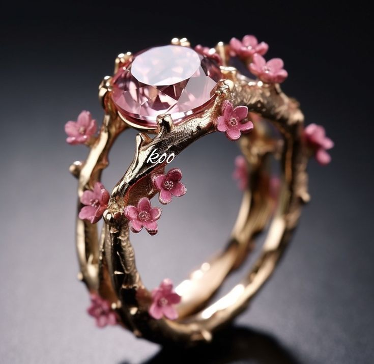 Enchanting gold ring with pink crystal and small flowers