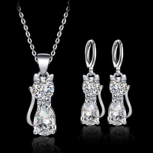 Necklace and earrings set with cats made of white zirconium